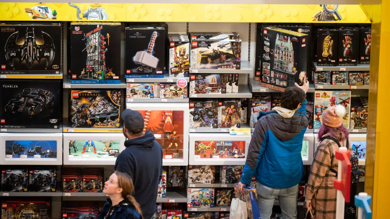 Adults are excited about selecting and buying a Lego set.