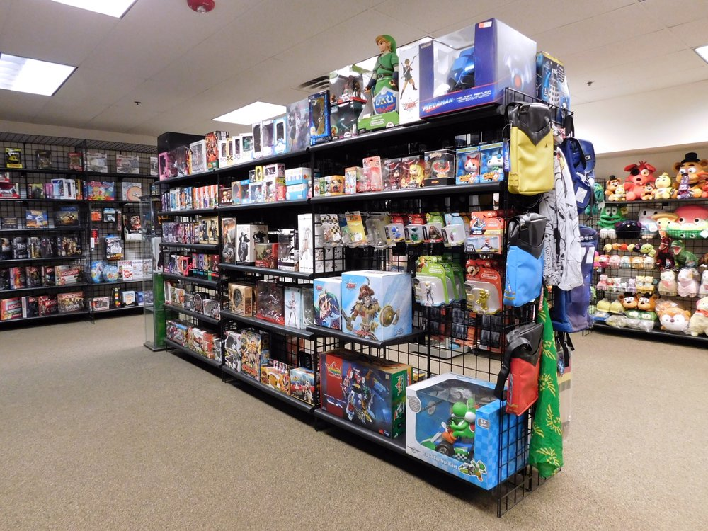 A Toynk store featuring action figures, collectibles, plush toys, and pop culture merchandise from popular franchises.