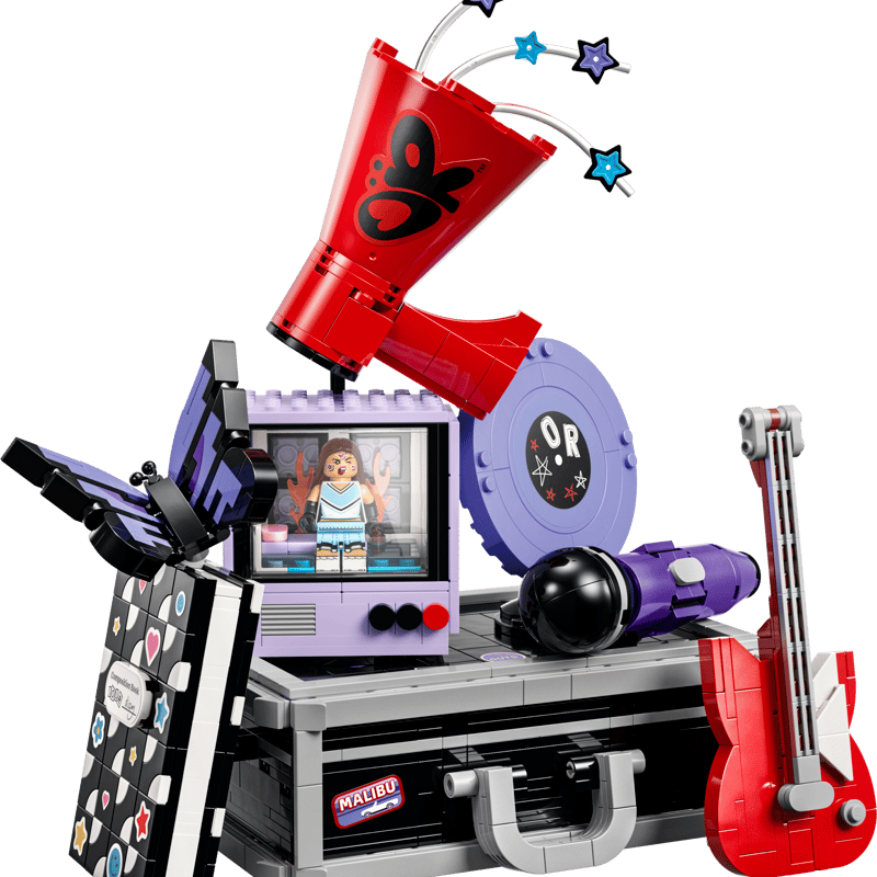 LEGO Olivia Rodrigo’s Secret Storage 43030 touring case opened to reveal the Good 4 U TV scene, lyric notebook, red guitar, and honeybee element.