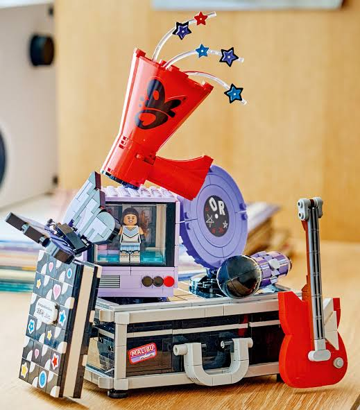 LEGO Olivia Rodrigo’s Secret Storage set 43030 featuring the concert touring case with hidden compartments and the Good 4 U cheerleader TV scene.