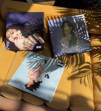 Limited-edition LEGO Olivia Rodrigo brick-built vinyl records styled with album cover artwork for SOUR and GUTS.