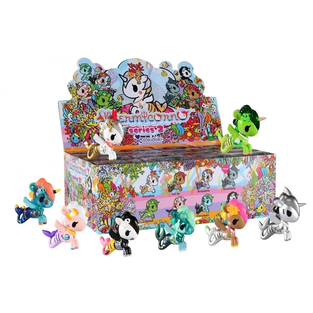 Group display featuring multiple Tokidoki Mermicorno figures showcasing various themes, translucent tails, and metallic finishes across different series.